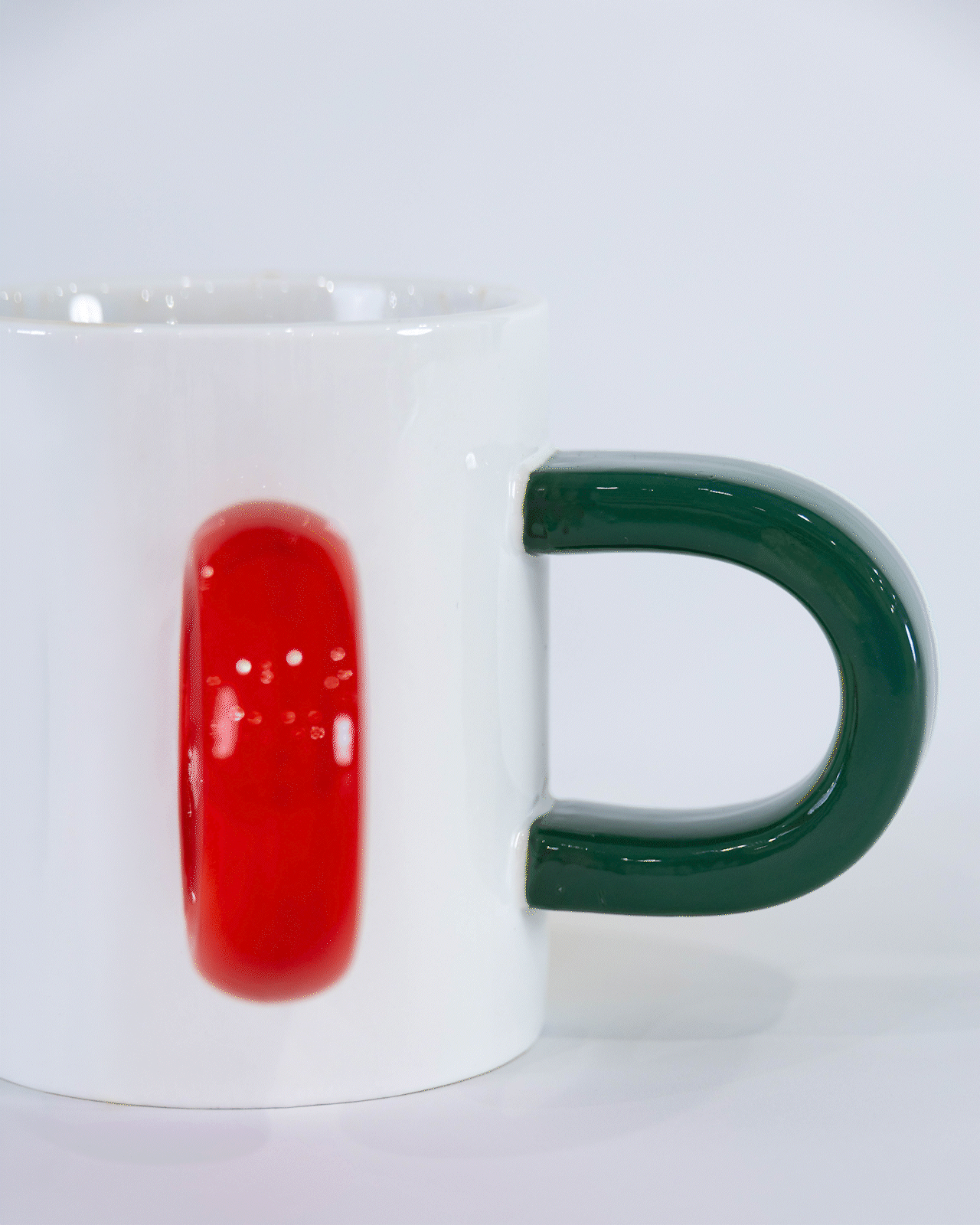 Rotating close-up of The Mood Mug’s five differently shaped handles